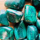 Edge view of Malachite tumbled stone, kept near for Emotional Healing and Protection.