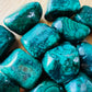 Overhead angle of Malachite tumbled stone, carried for Emotional Healing, from Haut-Katanga, Democratic Republic of the Congo.