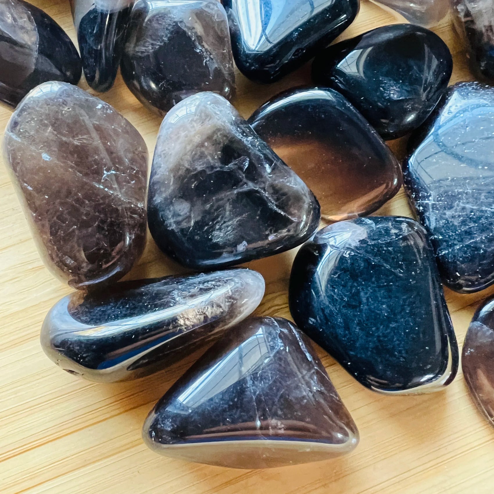 Macro view of Smoky Quartz tumbled stone, sourced from Vakinankaratra, Madagascar, traditionally used for Grounding.