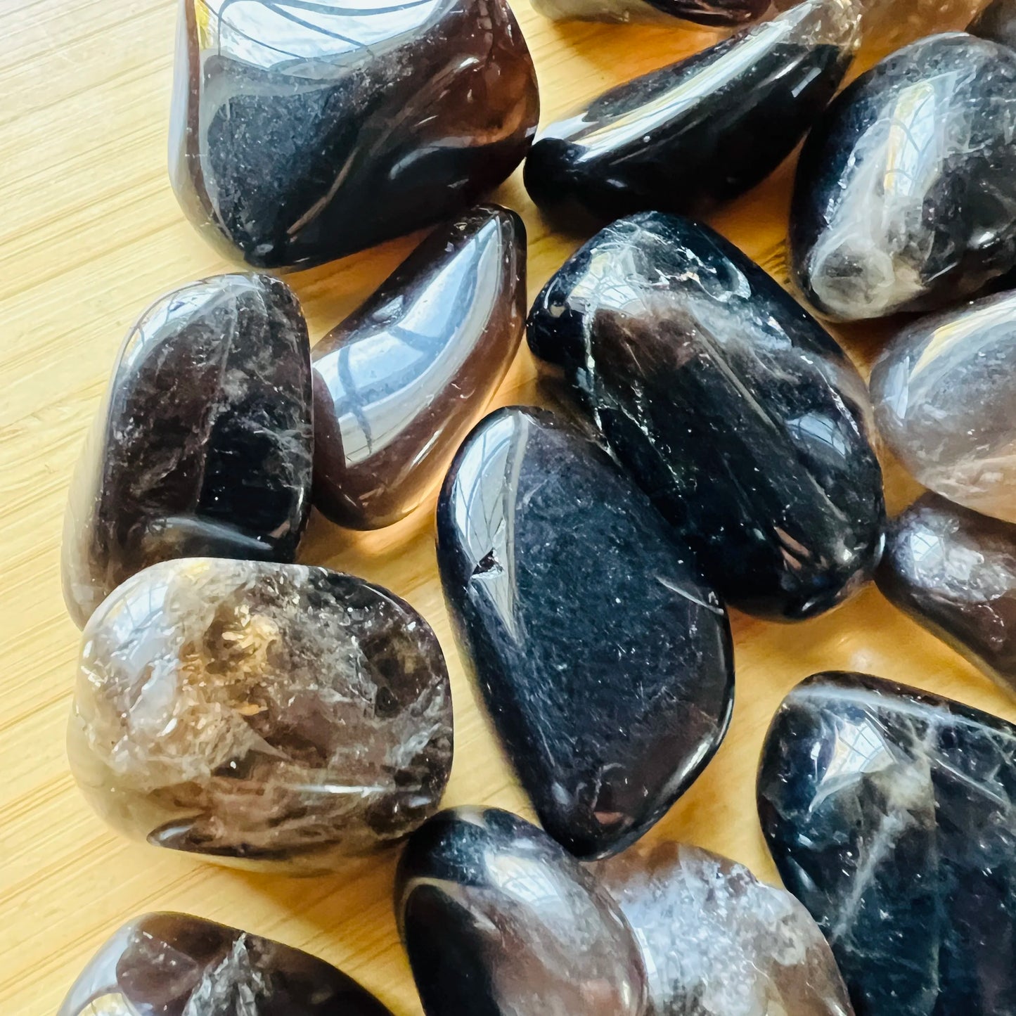 Side profile of Smoky Quartz tumbled stone, sourced from Madagascar, worked with for Grounding.