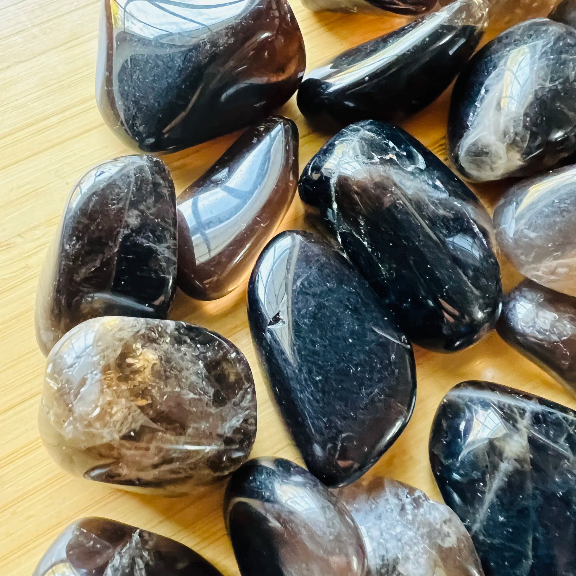 Side profile of Smoky Quartz tumbled stone, sourced from Madagascar, worked with for Grounding.