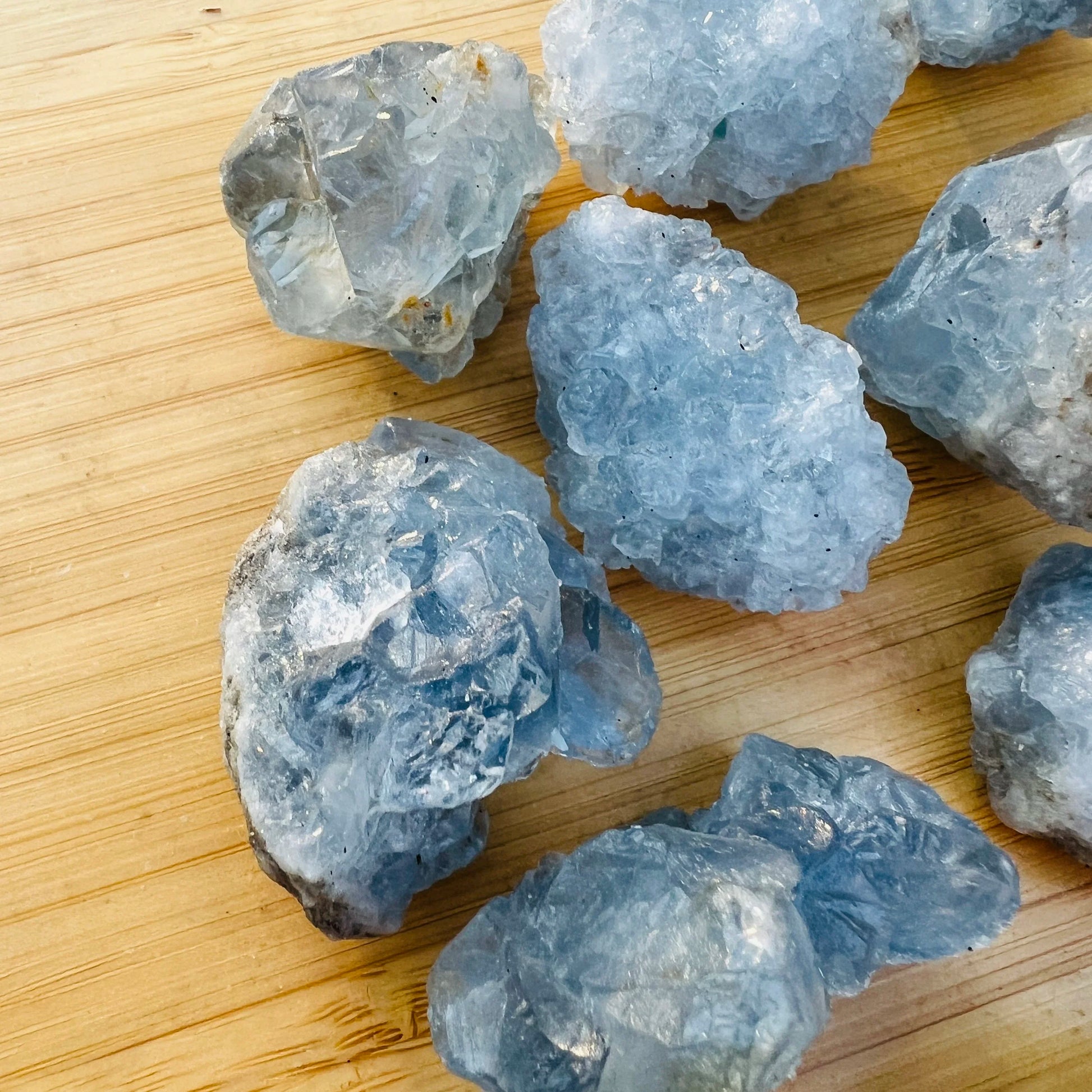 Edge view of Celestite raw stone, showing earthy tone.