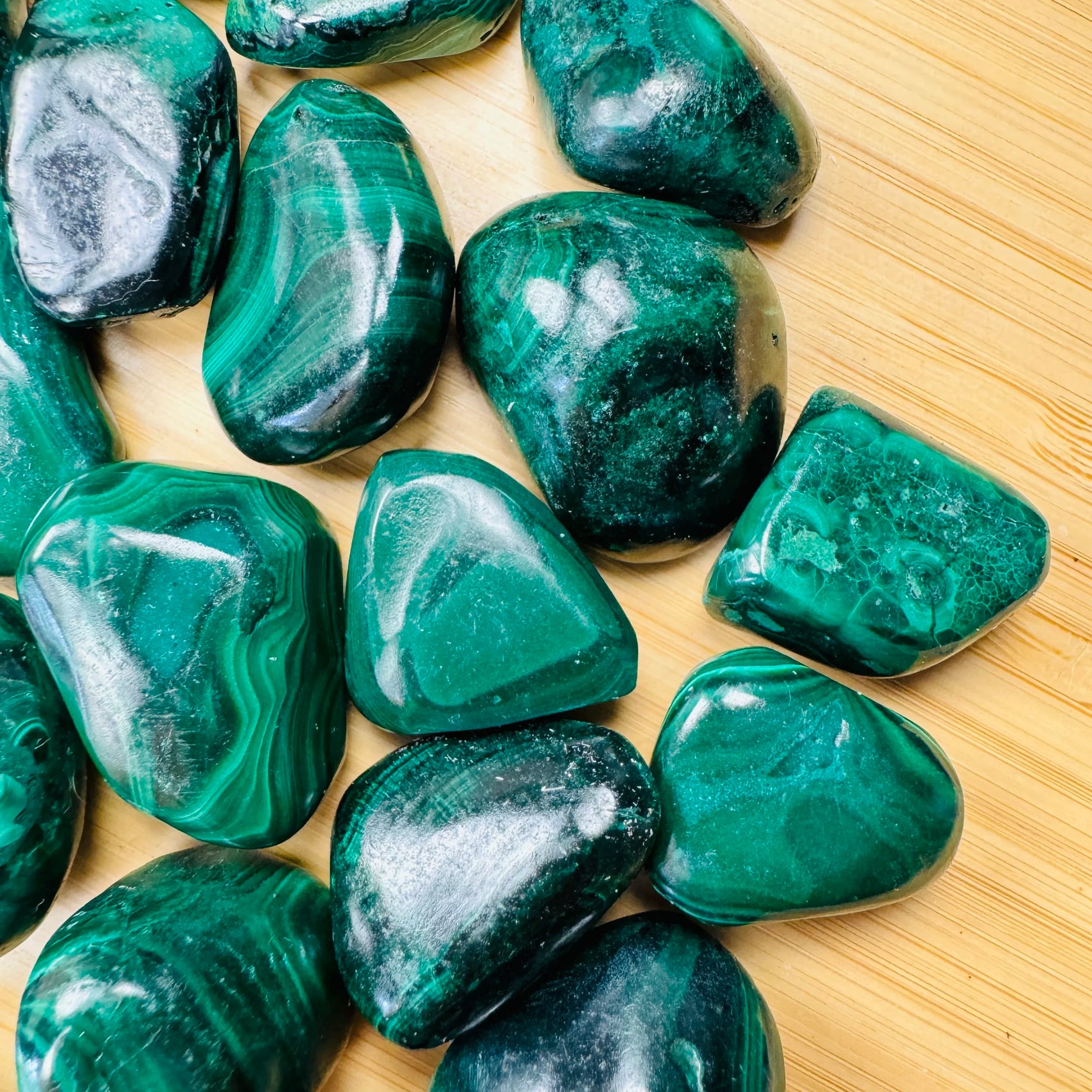 Near view of Malachite tumbled stone, often worked with for Emotional Healing.