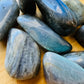Top view of Labradorite tumbled stone, showing glassy finish, hand-selected from Atsimo-Andrefana, Madagascar.