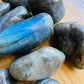 Palm-scale view of a Labradorite tumbled stone worked with for Intuition and Protection.