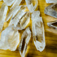 Top-down shot of Grade AA Lemurian Quartz raw point, showing characteristic patterning, for Meditation and Intuition.