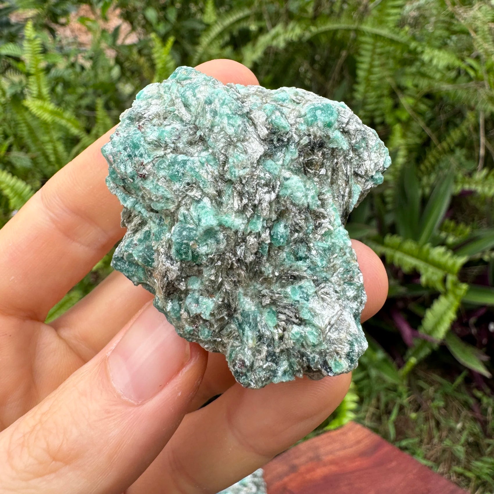 Top view of green Emerald specimen, showing natural patina.
