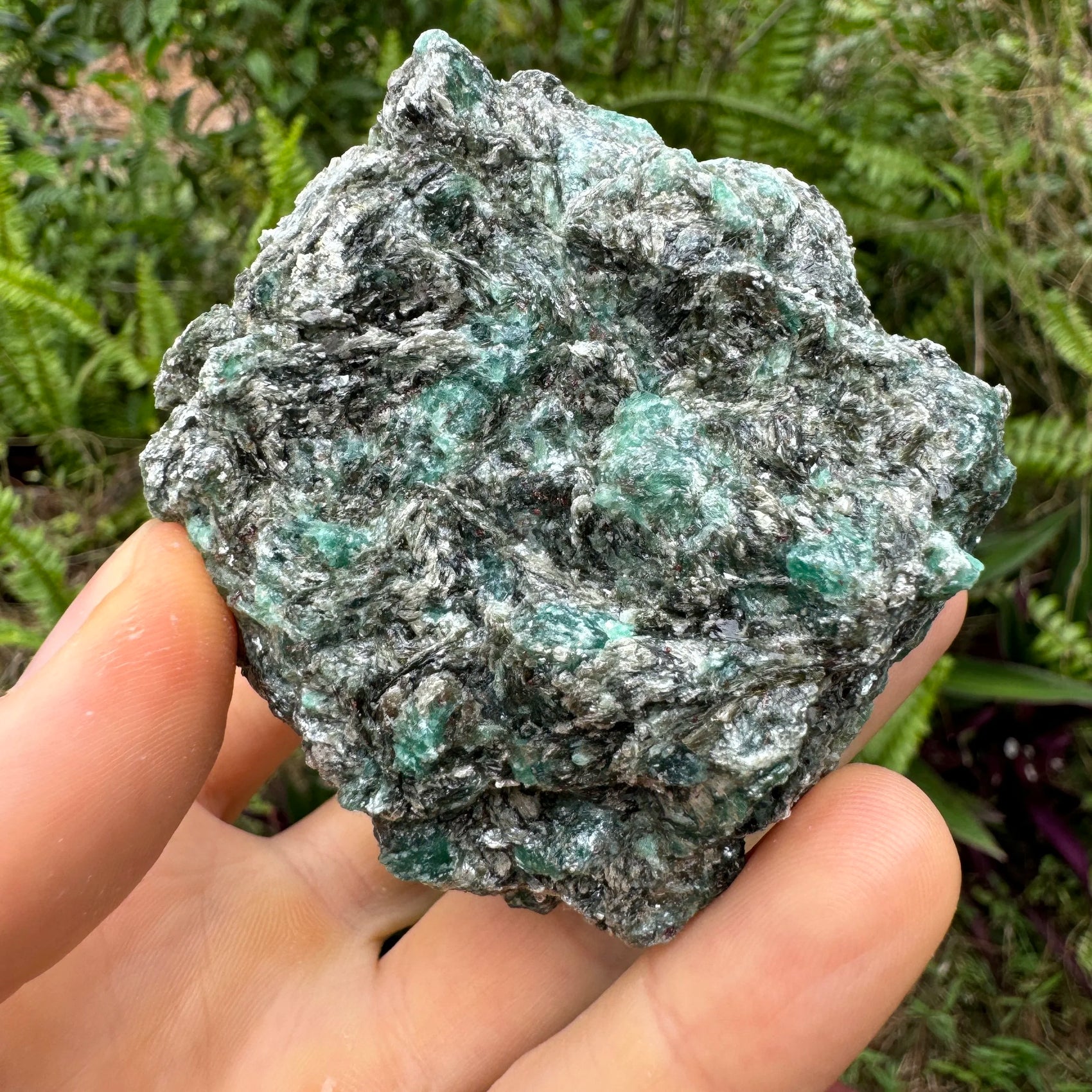 Rear view of Emerald specimen, often paired with practices around Love, showing raw matrix.