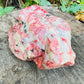 Detail shot of Grade AA Rhodonite specimen under natural light