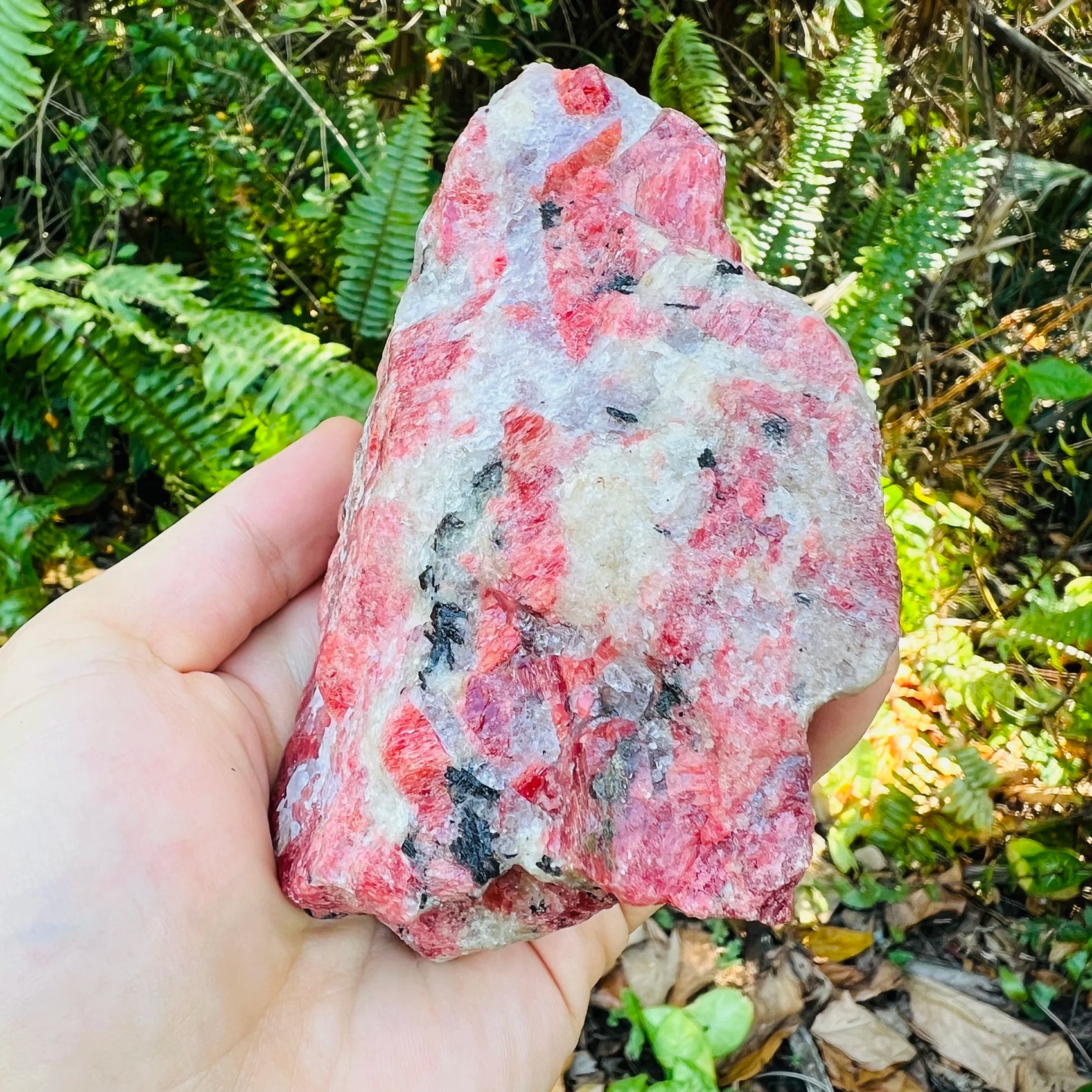Top angle of Rhodonite specimen, showing natural inclusions.
