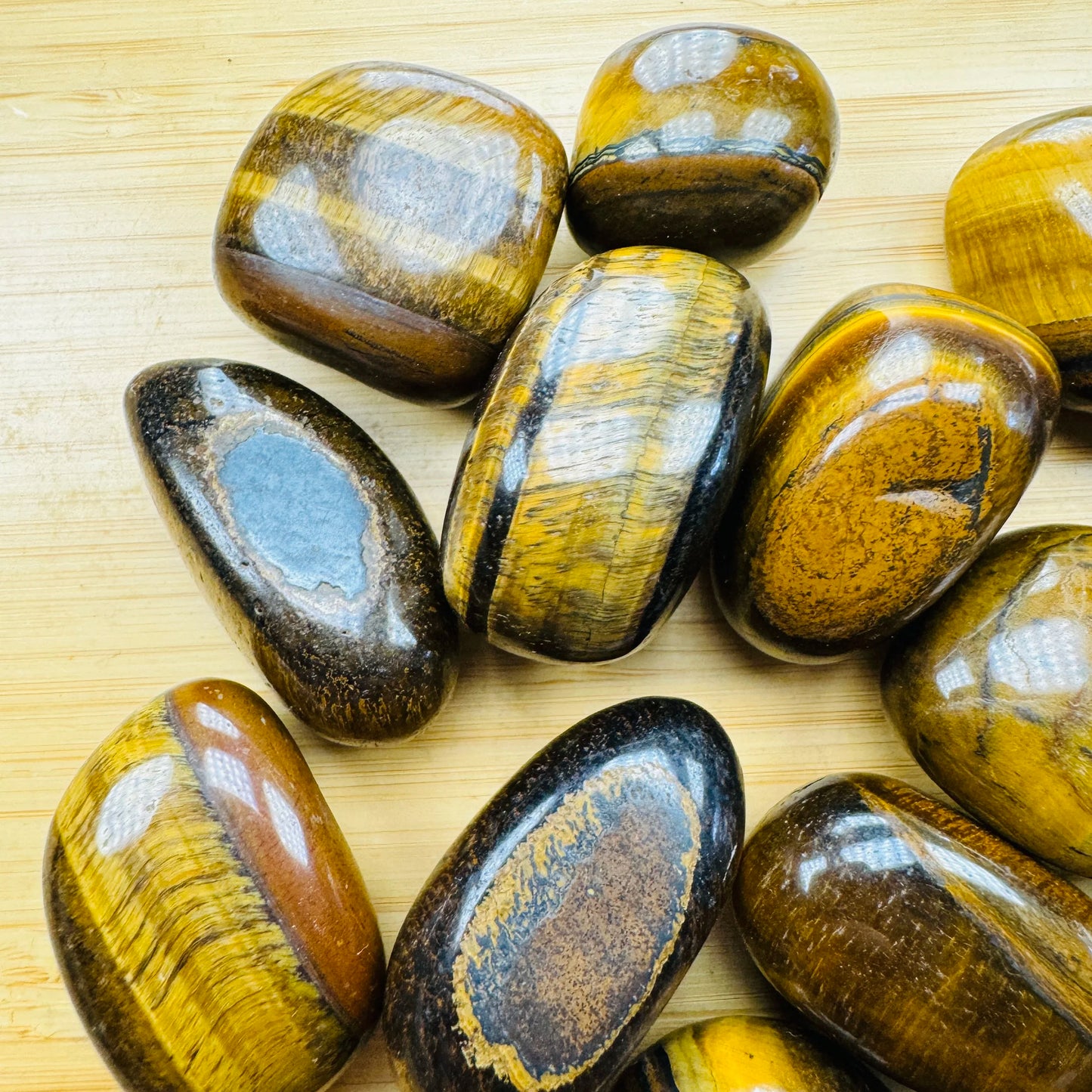 Rear view of Tiger Eye tumbled stone, from Northern Cape, South Africa, showing characteristic finish.