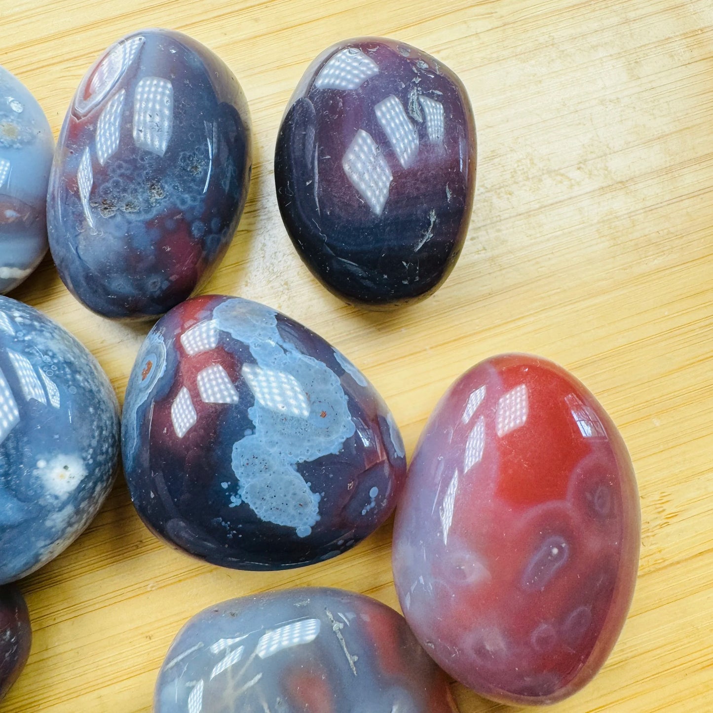 Full profile of Grade AA Red Agate tumbled stone ready to ship from Beyond Bohemian