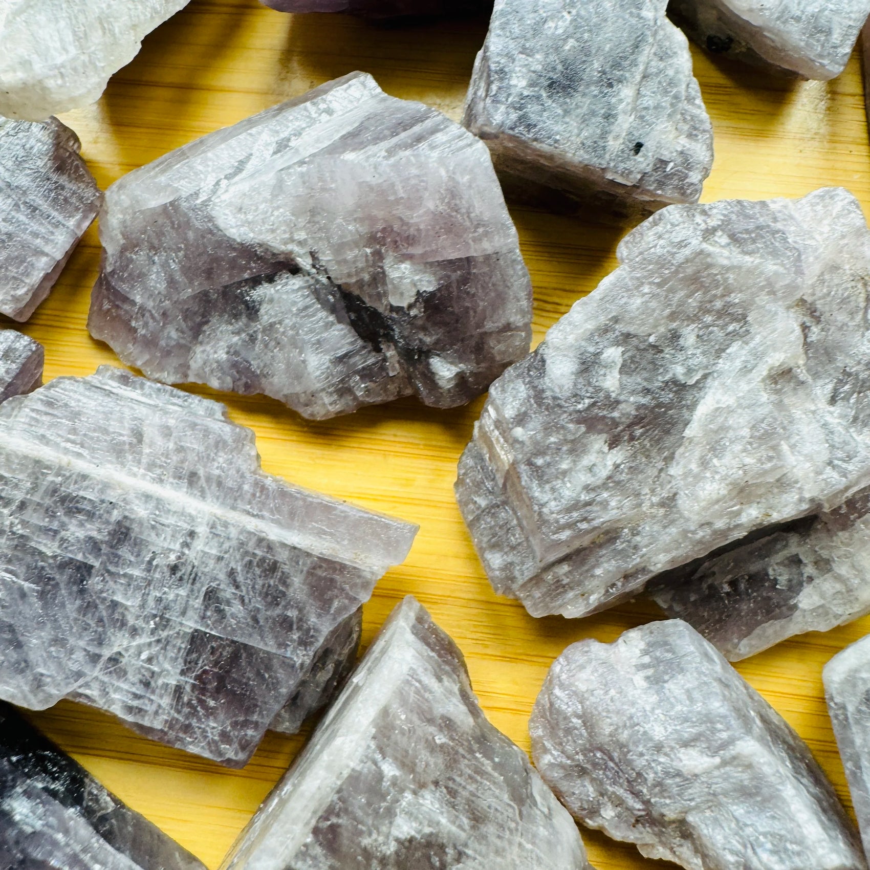 Side perspective of Anhydrite raw stone, showing raw matrix, for Meditation and Stress Relief.