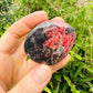 Underside detail of Rhodonite freeform, showing natural variation, sourced from Masvingo, Zimbabwe.