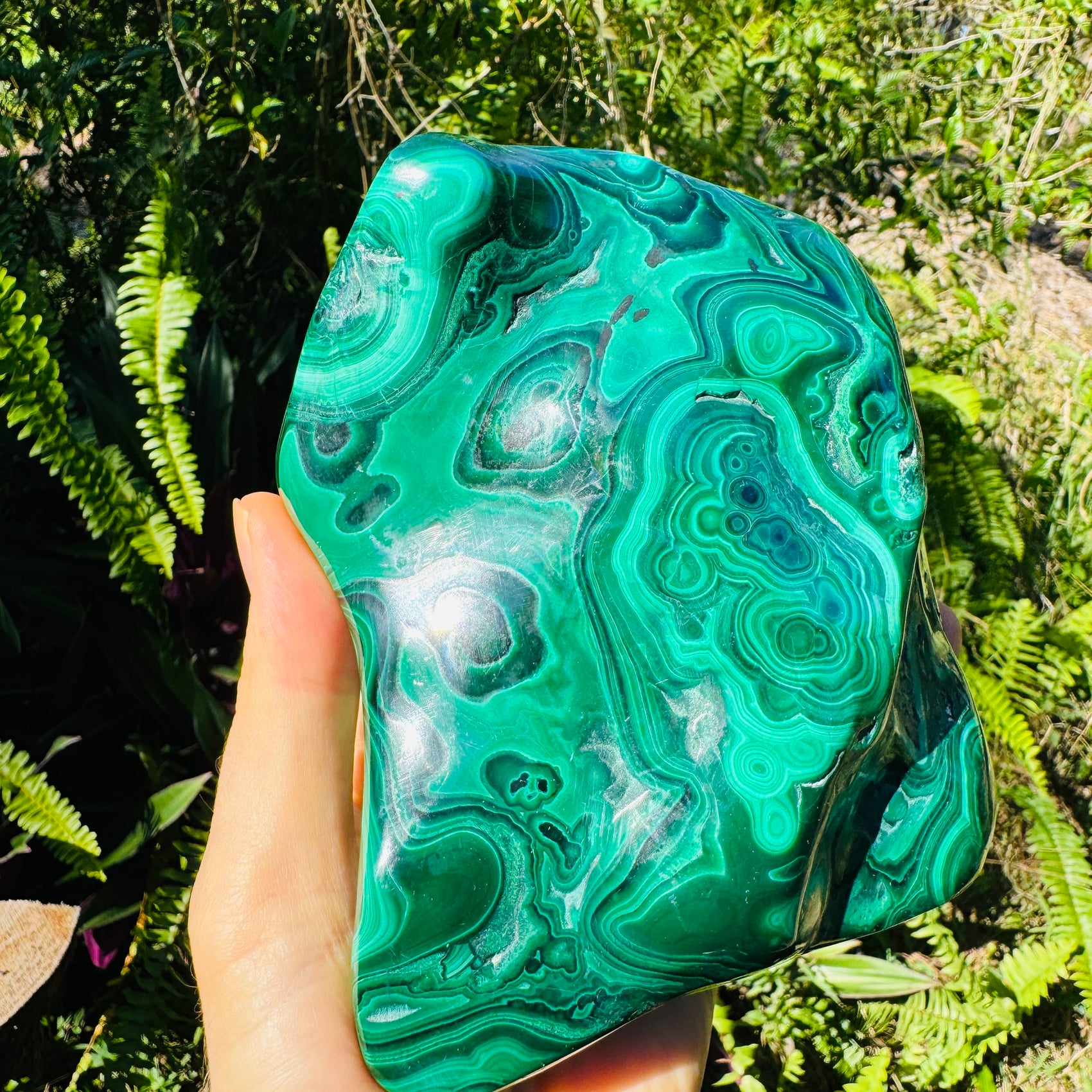 Up-close view of Malachite specimen, showing natural color depth.