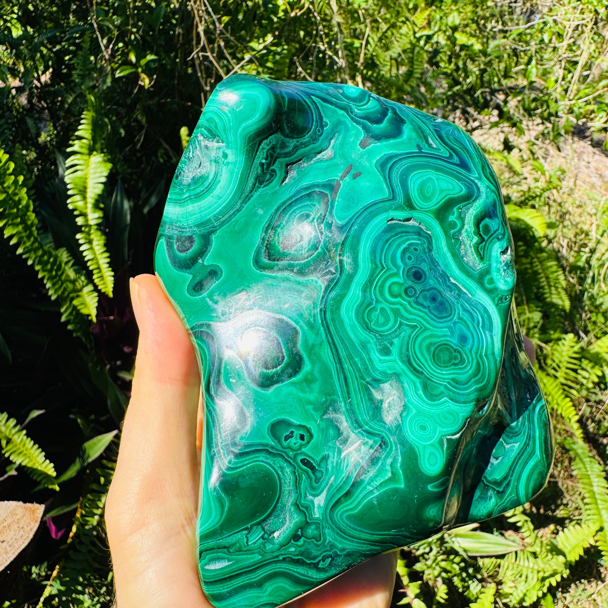 Up-close view of Malachite specimen, showing natural color depth.