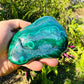 Palm-scale view of one Malachite specimen for scale, Democratic Republic of the Congo-sourced, from Haut-Katanga.