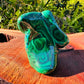 Detail shot of Grade AA Malachite specimen under natural light