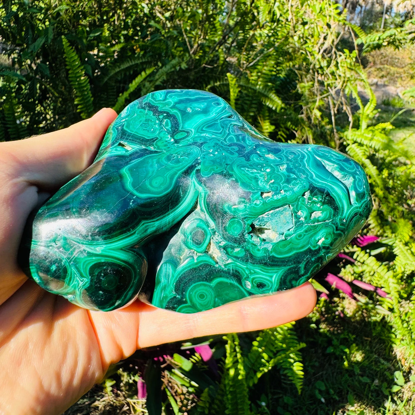 Bird's-eye view of Malachite specimen, often worked with for Emotional Healing, showing raw matrix.