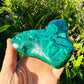Side-on view of Malachite specimen, worked with for Emotional Healing and Protection, showing tight grain.