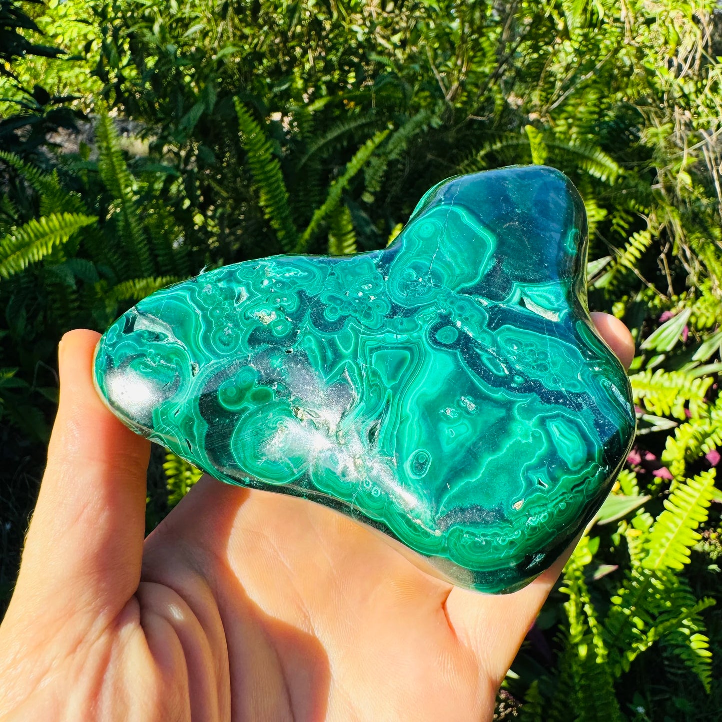 Side-on view of Malachite specimen, worked with for Emotional Healing and Protection, showing tight grain.