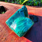 Hand-scale shot of a single Malachite specimen from Haut-Katanga, Democratic Republic of the Congo.