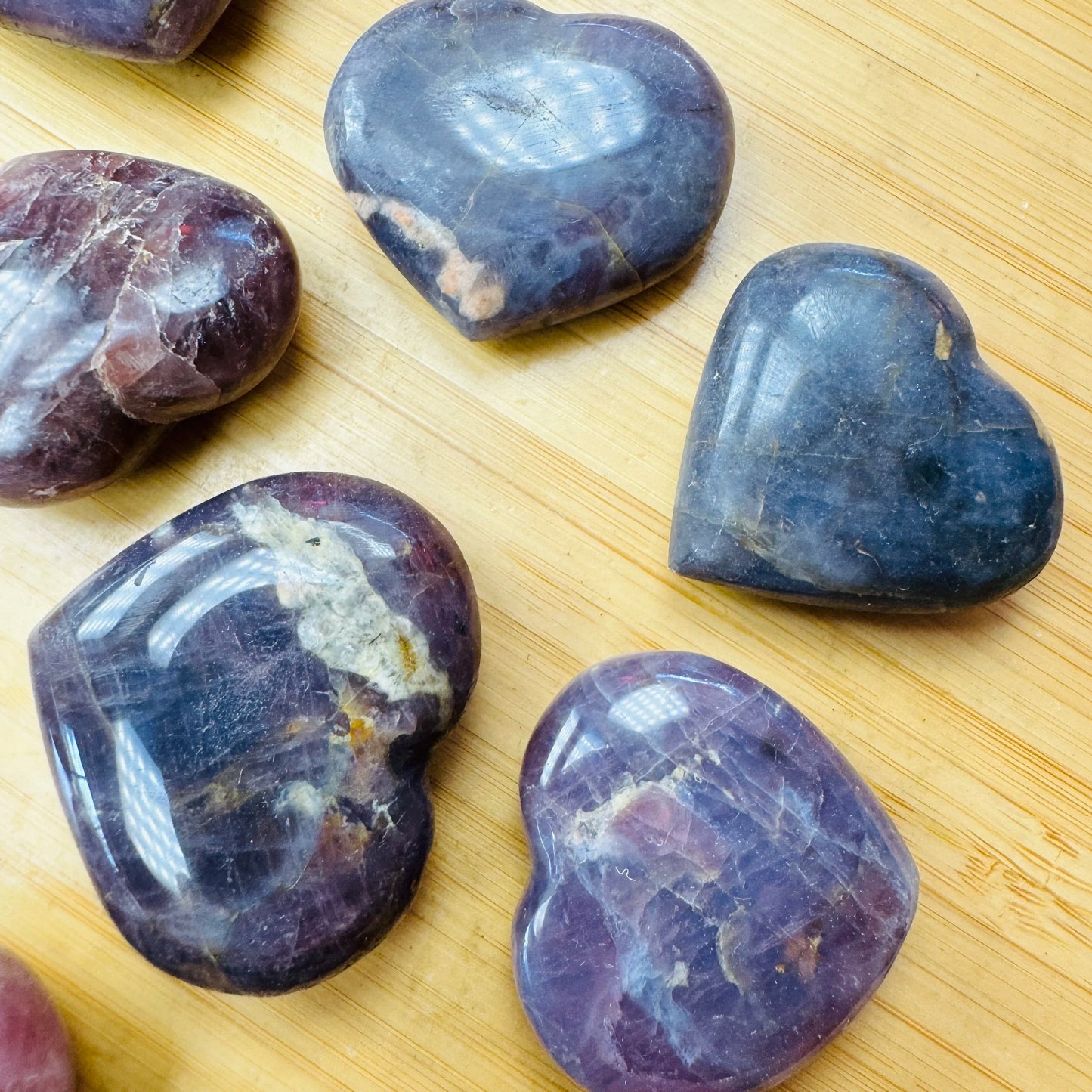 Grain detail of Blue Rose Quartz polished heart, showing color depth.