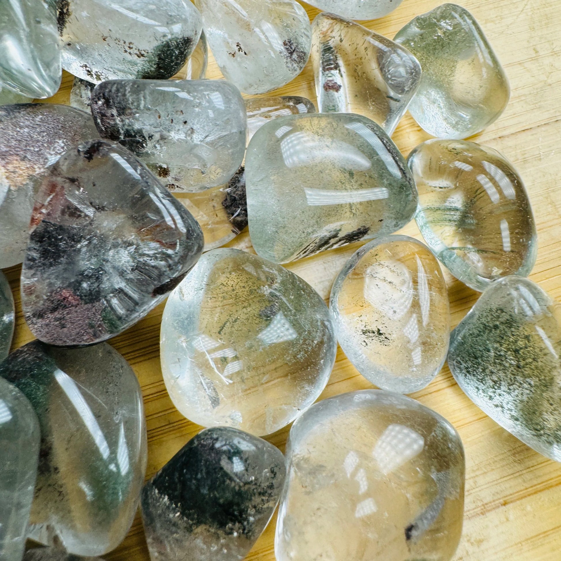 Bird's-eye view of Lodolite tumbled stone, hand-selected from Brazil.