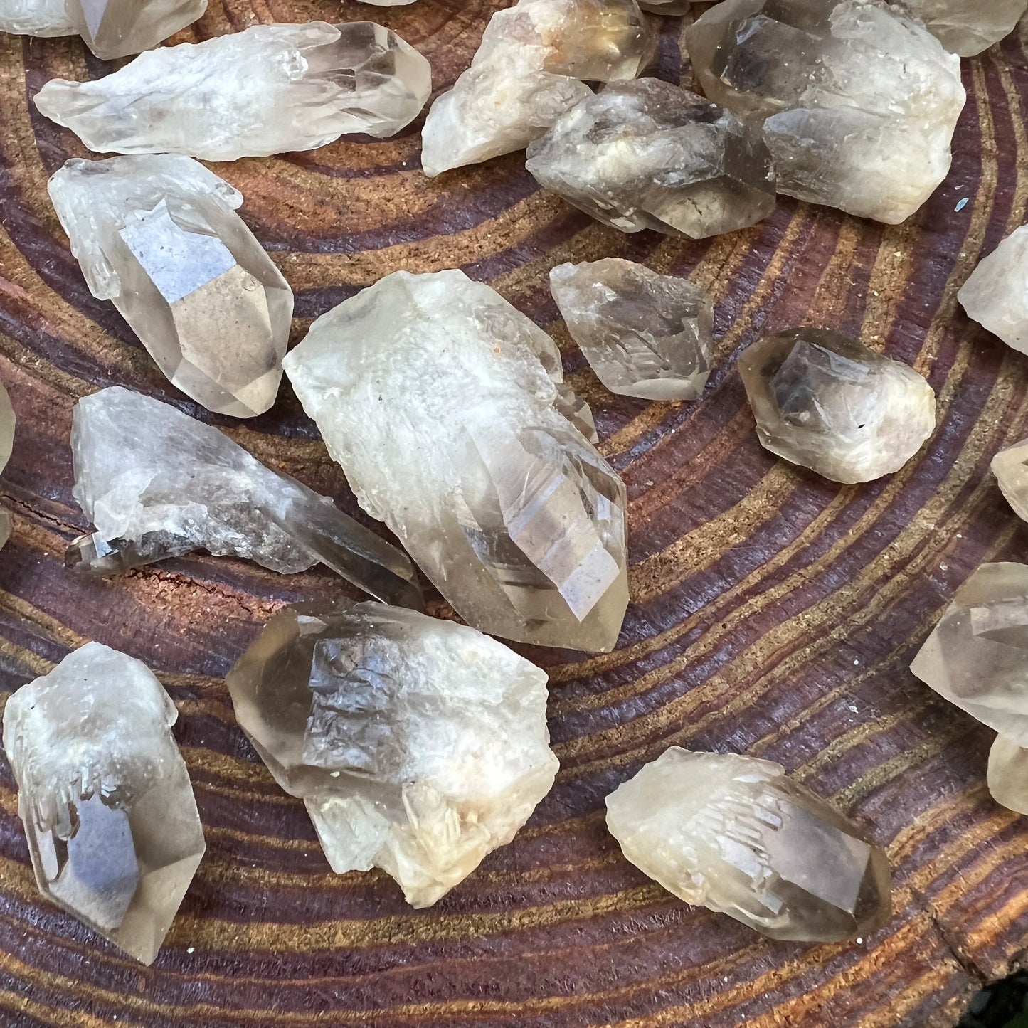 Bird's-eye view of Grade AA Smoky Quartz raw point, showing natural color depth, hand-selected from Chivhu, Zimbabwe.