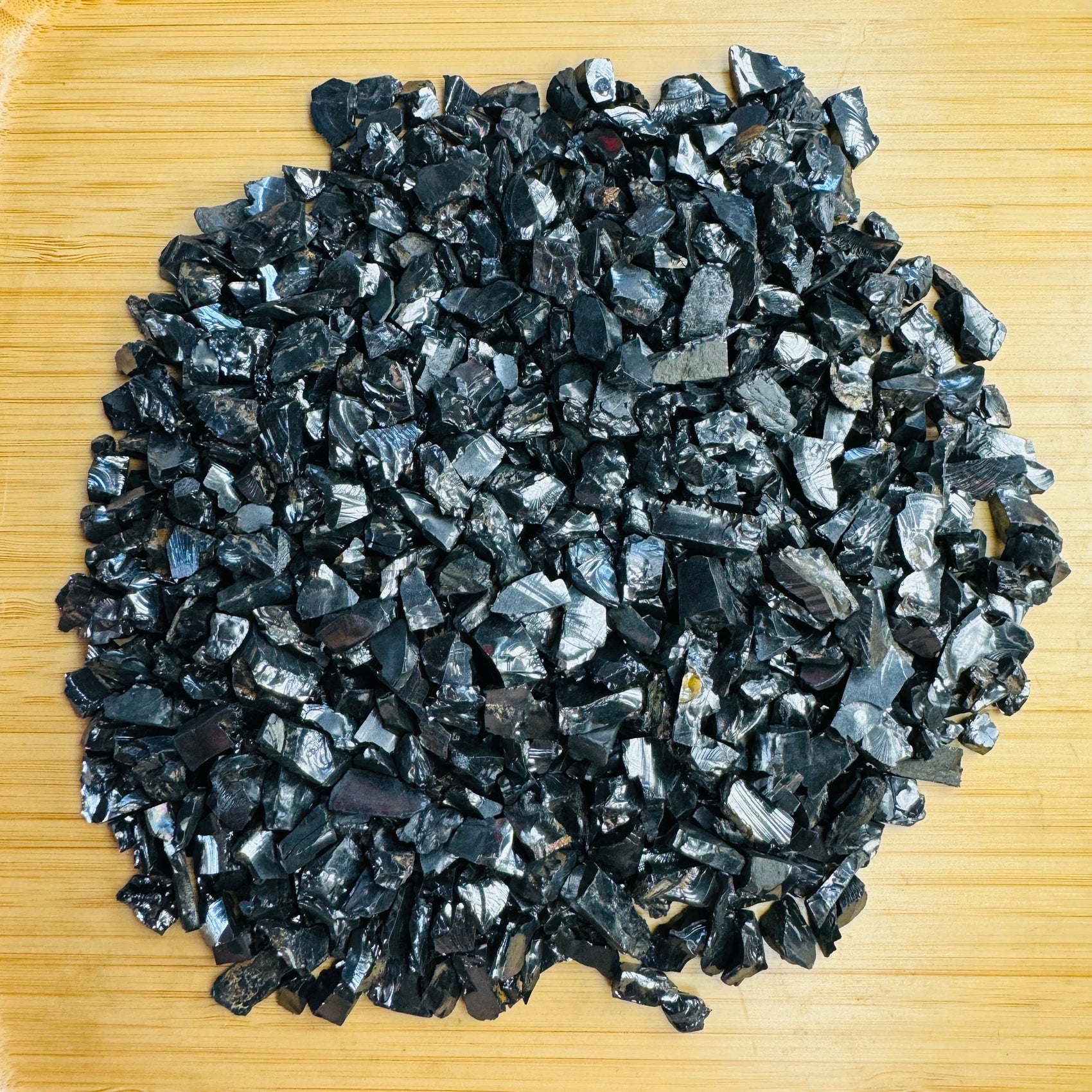 Up-close view of black Shungite raw stone, often kept for Protection.