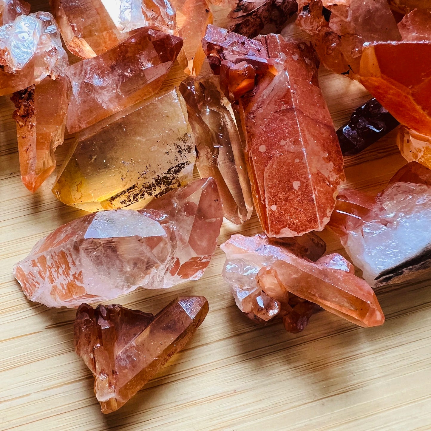 Profile view of Tangerine Quartz raw point, showing honest grain, sourced from Brazil.