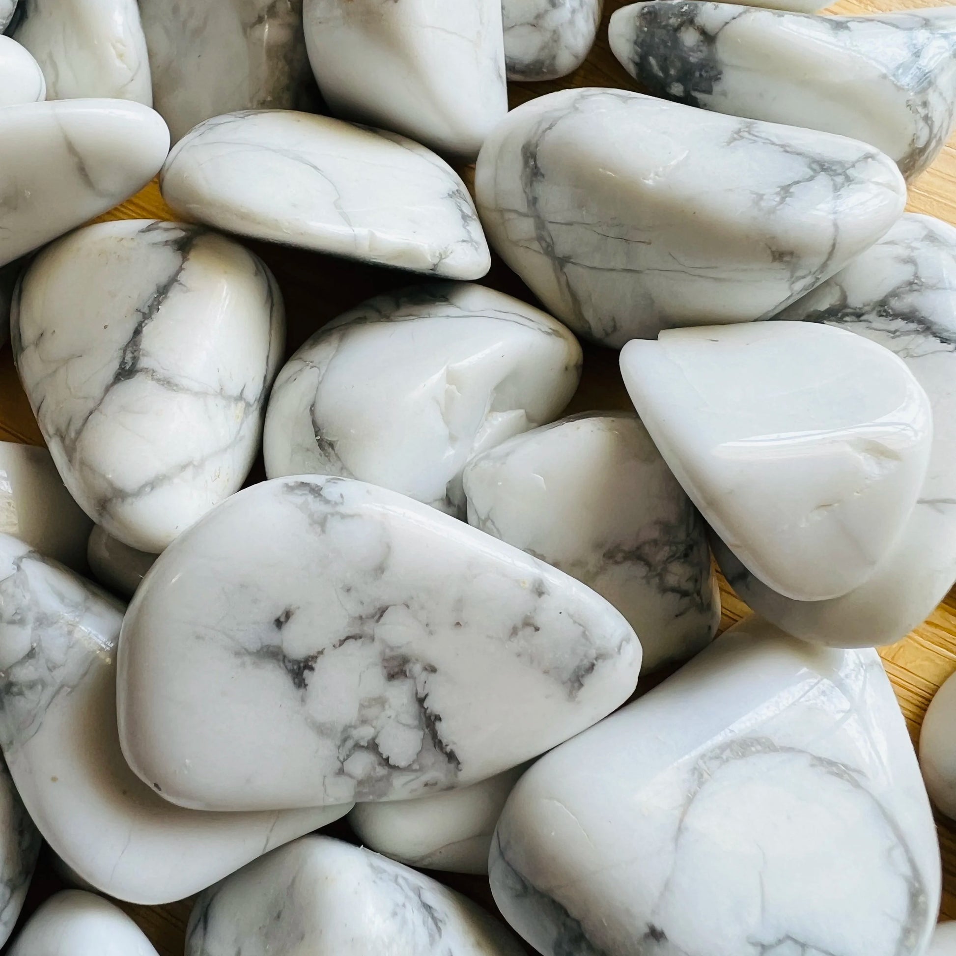 Size comparison with a single Howlite tumbled stone hand-selected from Masvingo, Zimbabwe.