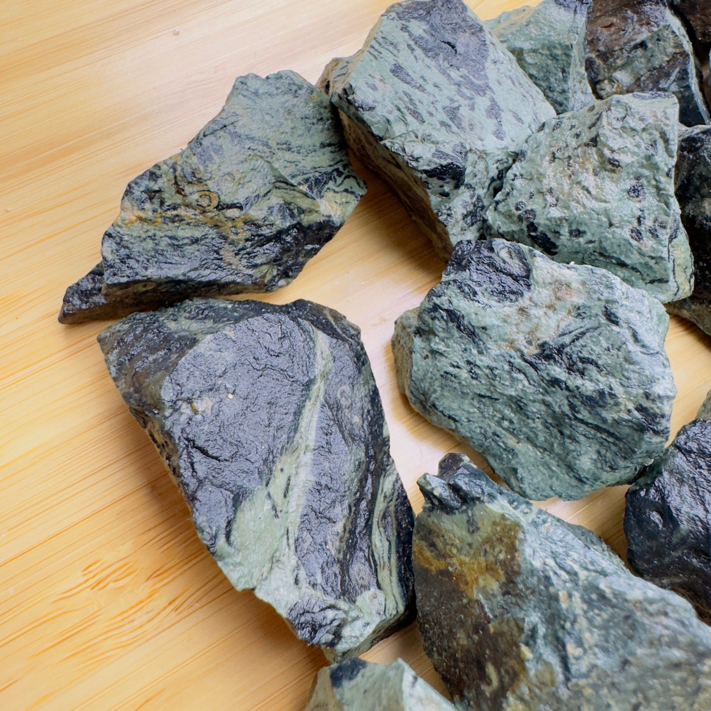 Close-up of Kambaba Jasper raw stone from Madagascar, soothing wellness stone for Emotional Healing