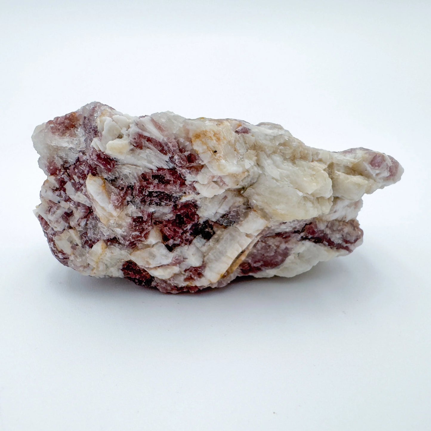 Held in hand, a Lepidolite specimen, sourced from Brazil.