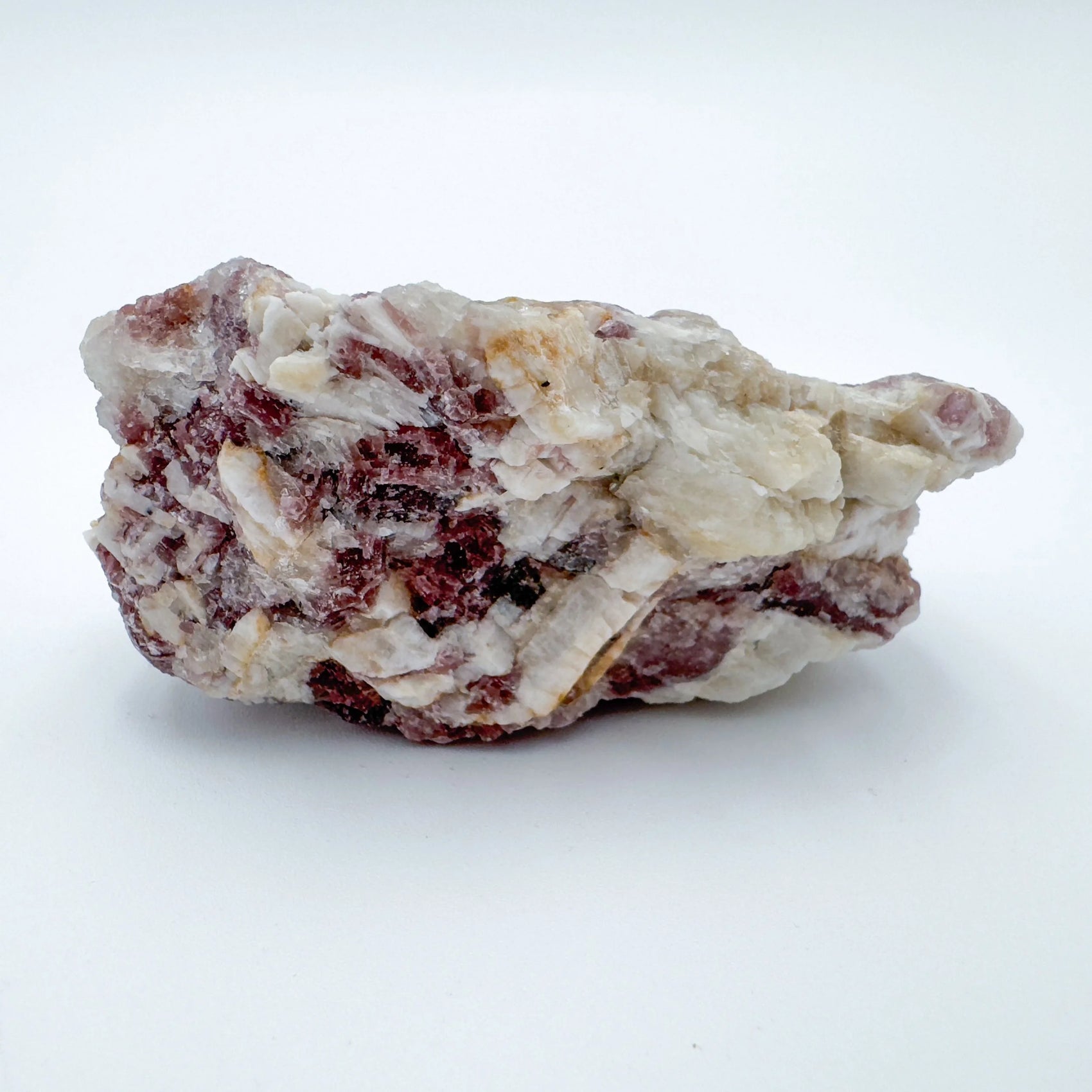 Held in hand, a Lepidolite specimen, sourced from Brazil.