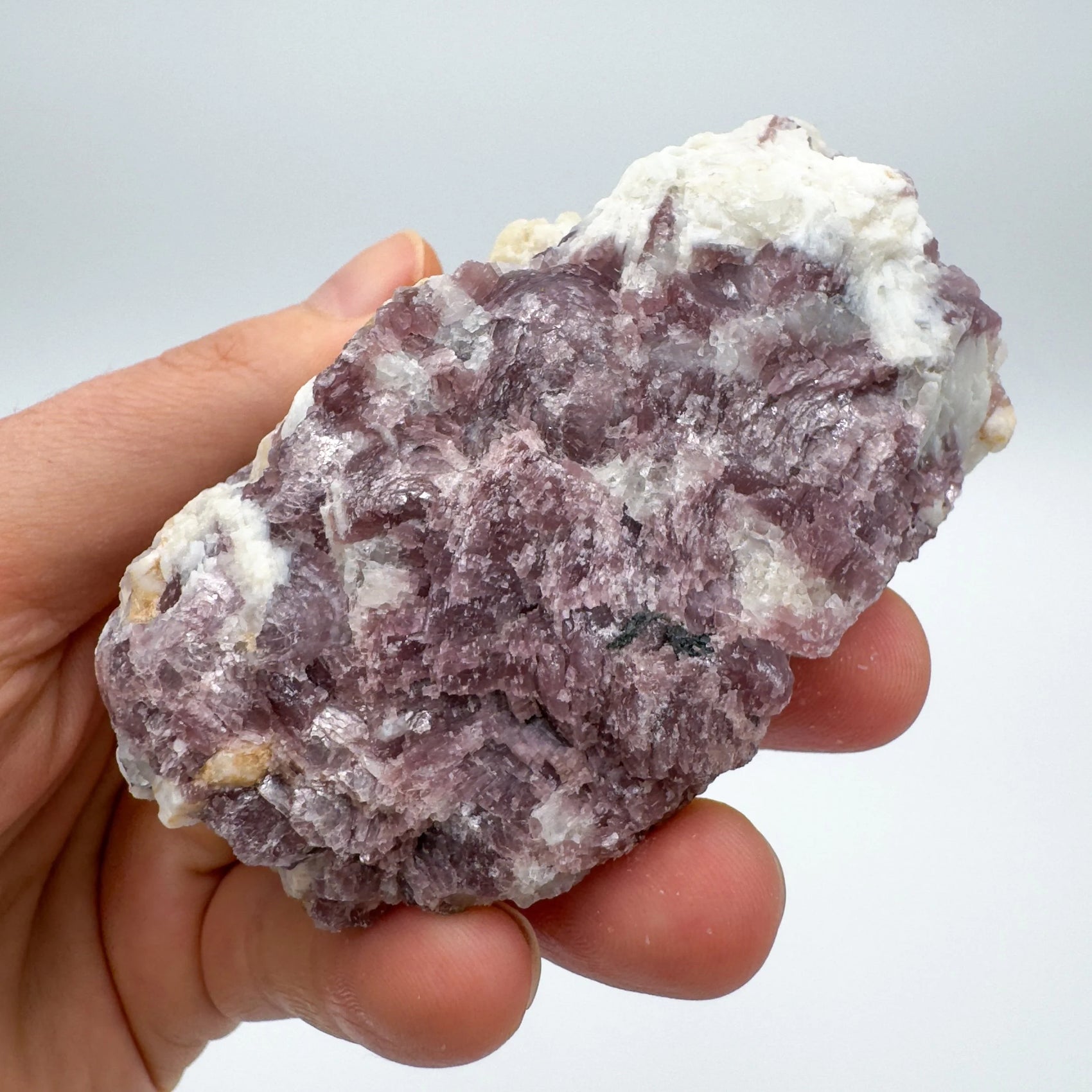 Detail shot of Grade AA Lepidolite cluster under natural light