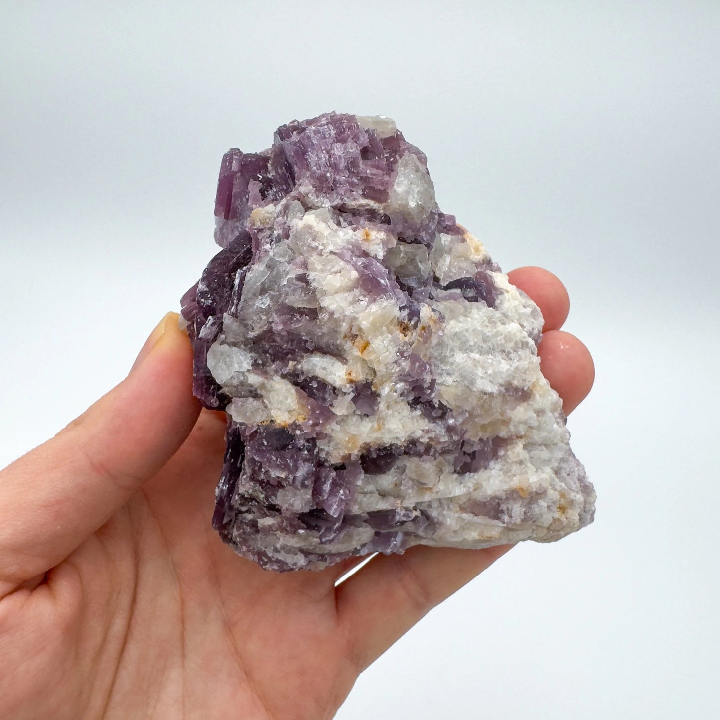 Tabletop view of Lepidolite specimen, with depth visible across the surface.