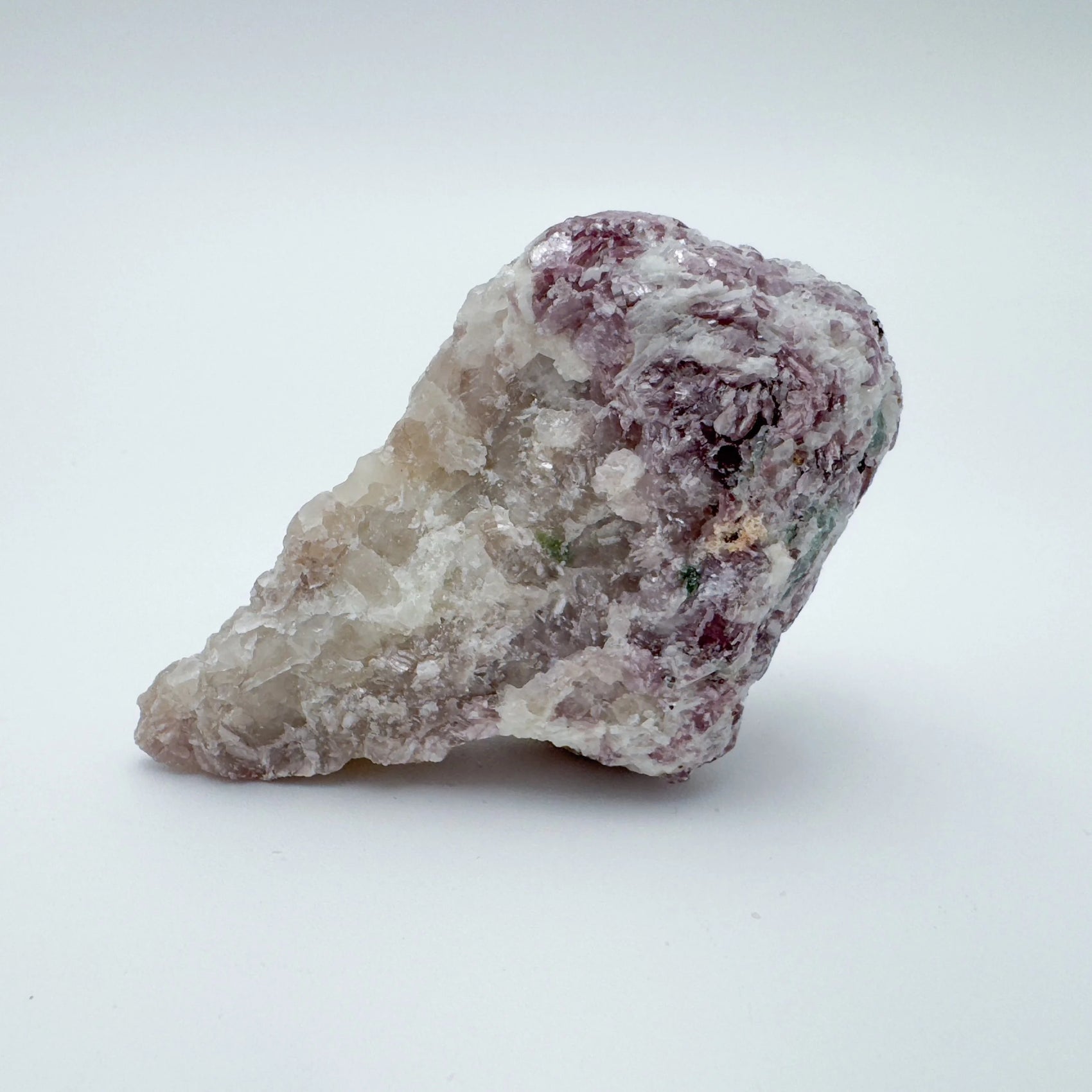 Side profile of Lepidolite specimen, showing natural color depth, sourced from Brazil.