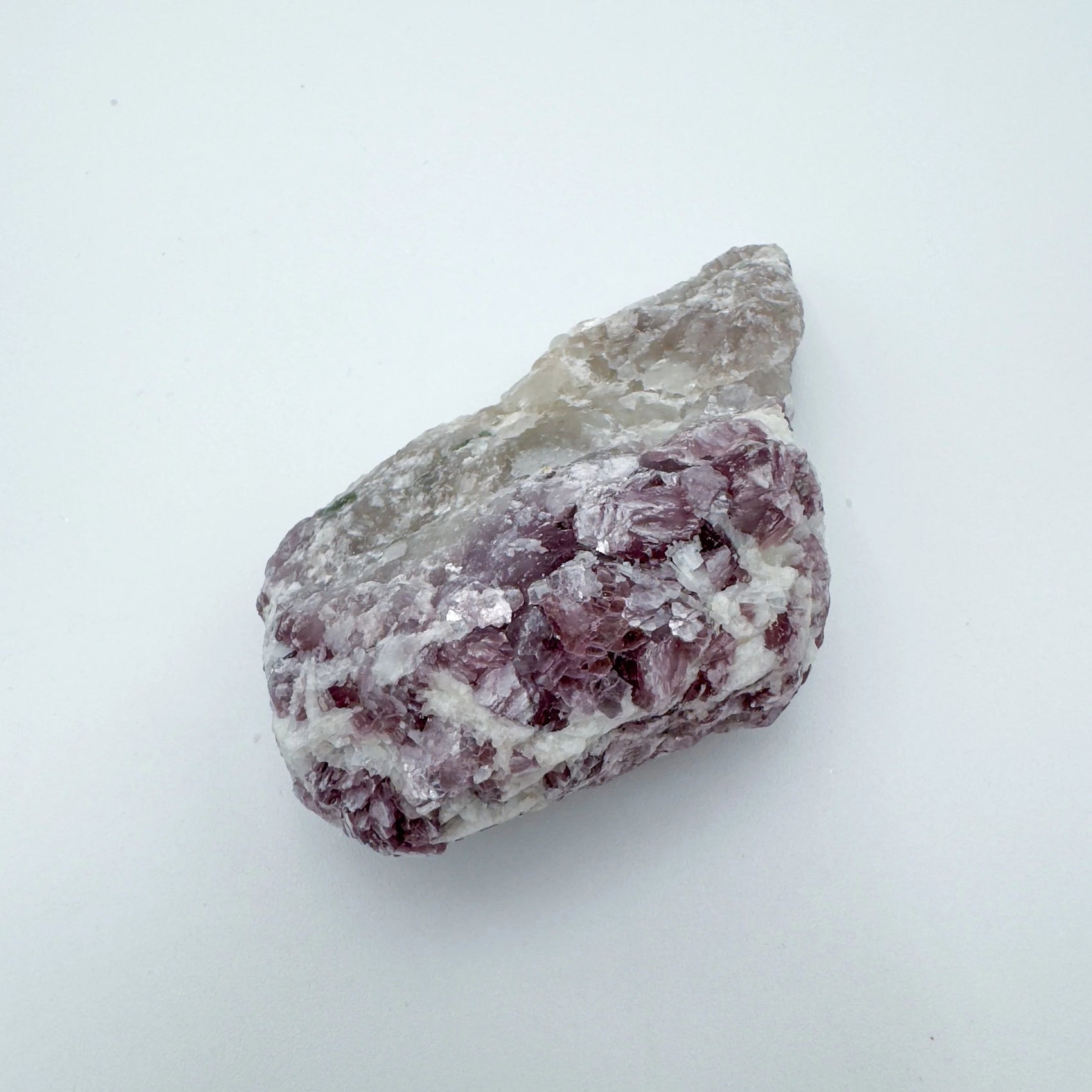 Underside view of Grade AA Lepidolite specimen, sourced from Minas Gerais, Brazil, showing characteristic finish.
