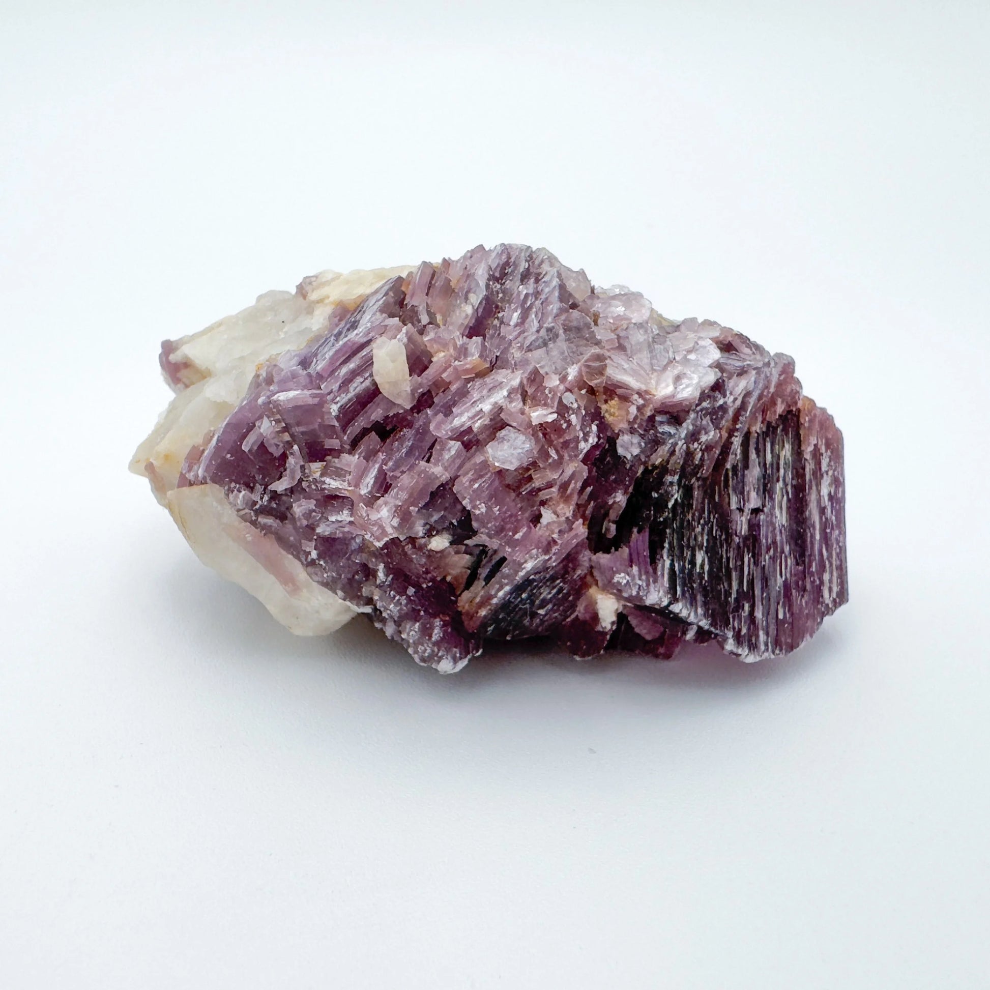 Up-close view of Lepidolite specimen, showing characteristic finish, kept close for Stress Relief.