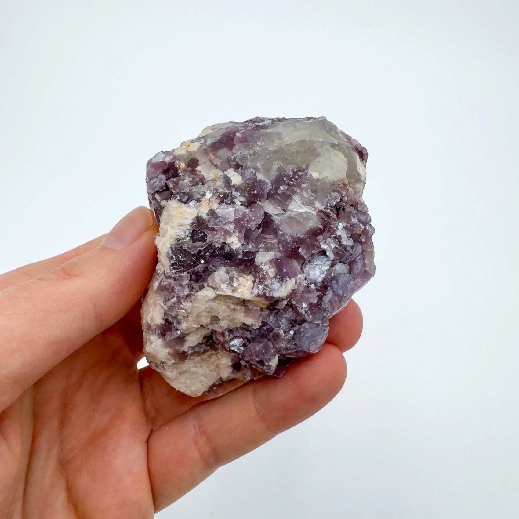 Detail shot of Grade AA Lepidolite cluster under natural light