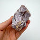 Detail shot of Grade AA Lepidolite cluster under natural light
