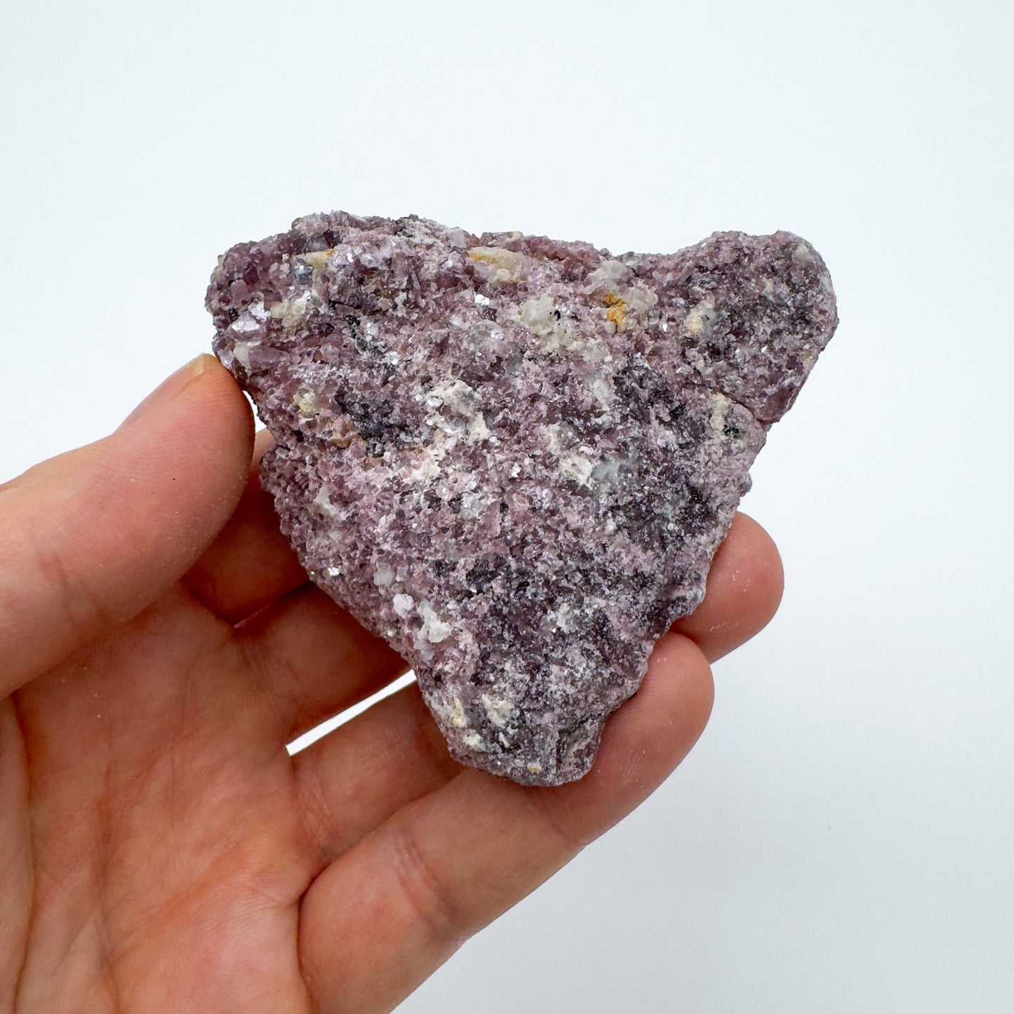 Palm-scale view of a single Lepidolite specimen from Brazil.