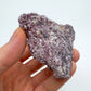 Soft-light view of Lepidolite specimen, often kept for Sleep, with surface texture in view.