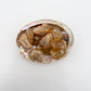 Detail of Grade A Natural Citrine raw stone, hand-selected from Haut-Lomami, Democratic Republic of the Congo, showing open form.