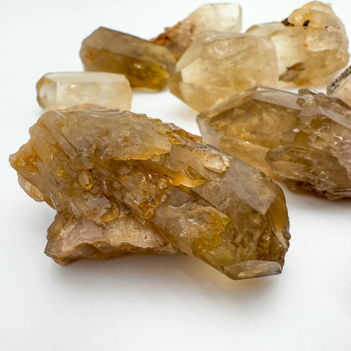 Profile view of Natural Citrine raw stone, sourced from Democratic Republic of the Congo, showing honest grain.