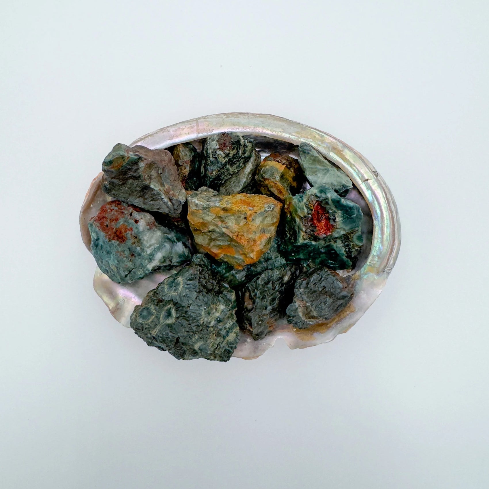 Up-close view of Ocean Jasper raw stone, sourced from Madagascar, often kept for Emotional Healing.