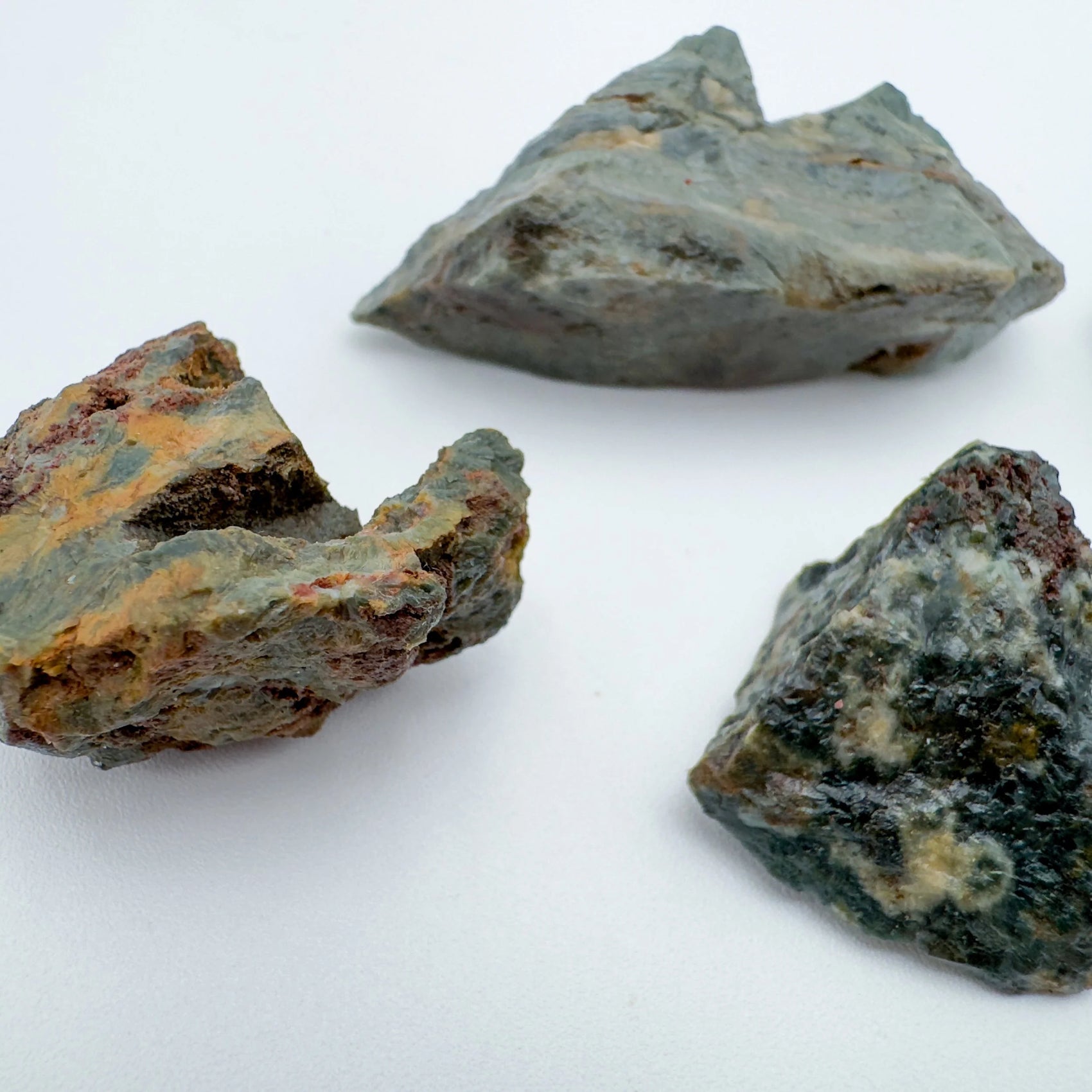 In context of an Ocean Jasper raw crystal, set to give a sense of weight.