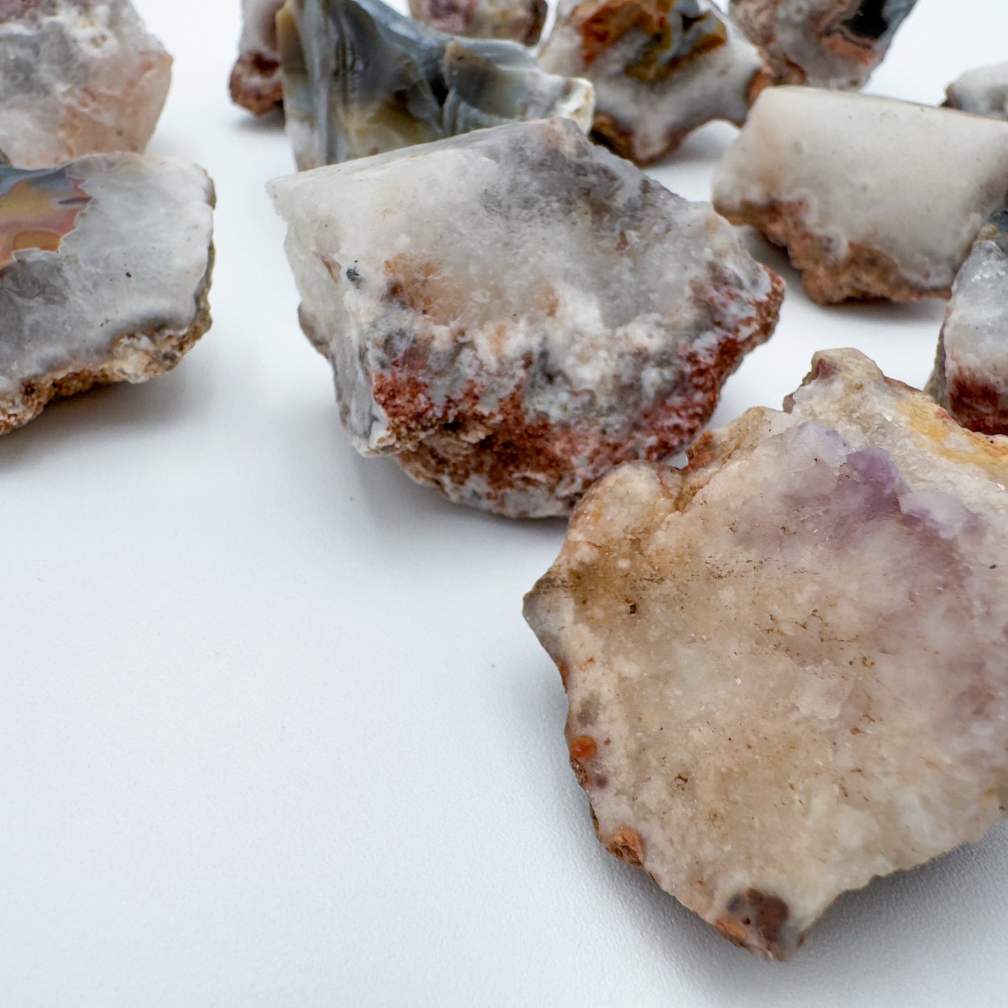 Edge view of Patagonia Agate raw stone, showing characteristic color.