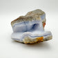 Macro view of Blue Lace Agate raw geode, showing natural sheen.